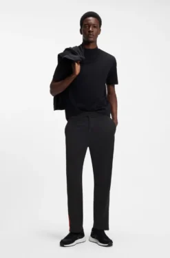 Relaxed-fit tracksuit bottoms with logo tape