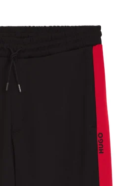 Relaxed-fit tracksuit bottoms with logo tape