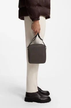 Reporter bag with silver-tone logo lettering