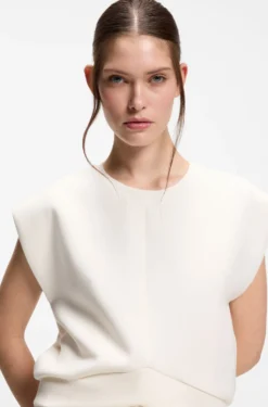 Sleeveless loose-fit sweatshirt with V-cut hemline
