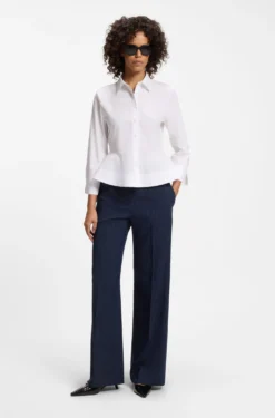 Slim-fit blouse in cotton with peplum hem
