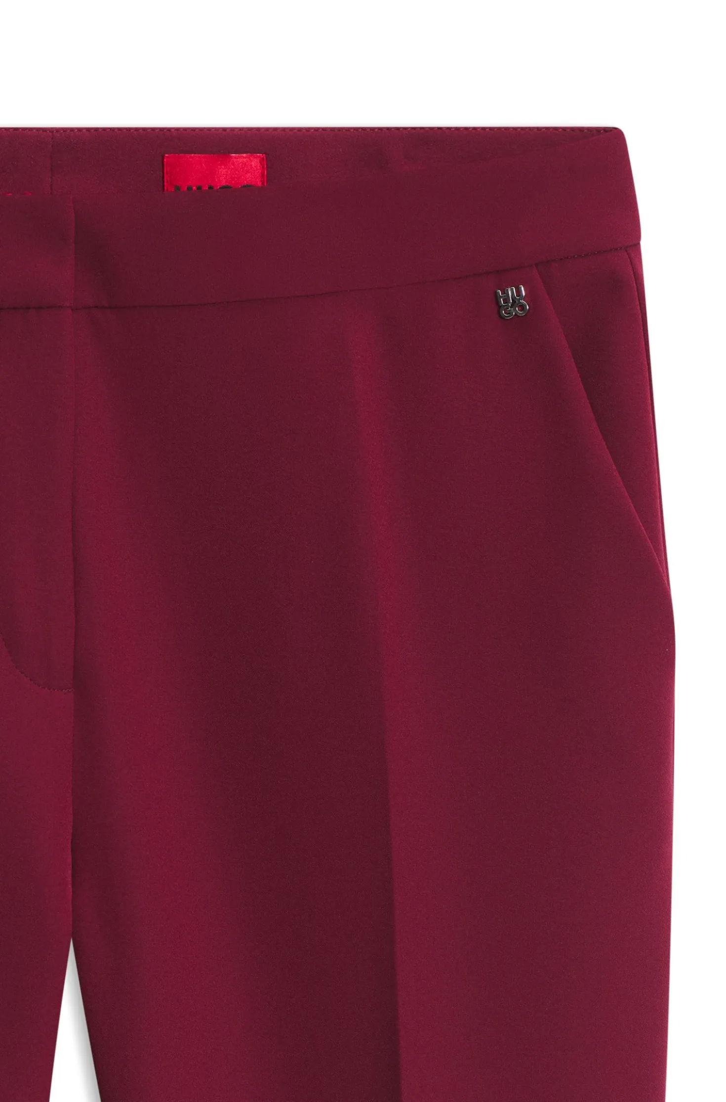 Slim-fit trousers in stretch fabric with logo rivet