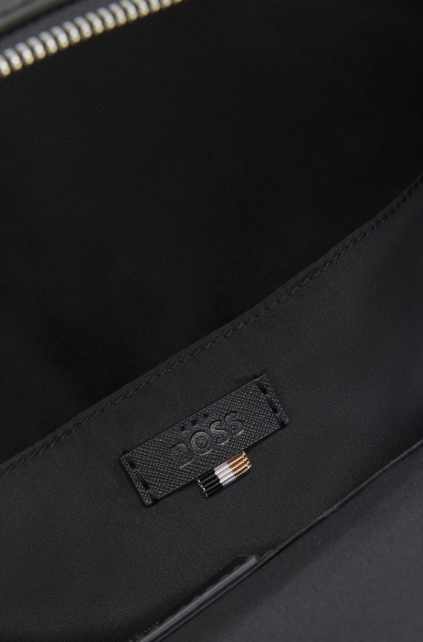 Structured backpack with polished logo lettering