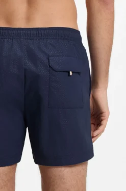 Swim shorts with all-over monogram print