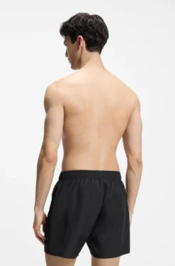 Swim shorts with all-over stacked logos