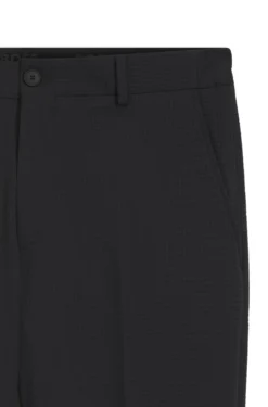 Tapered-fit trousers in stretch seersucker