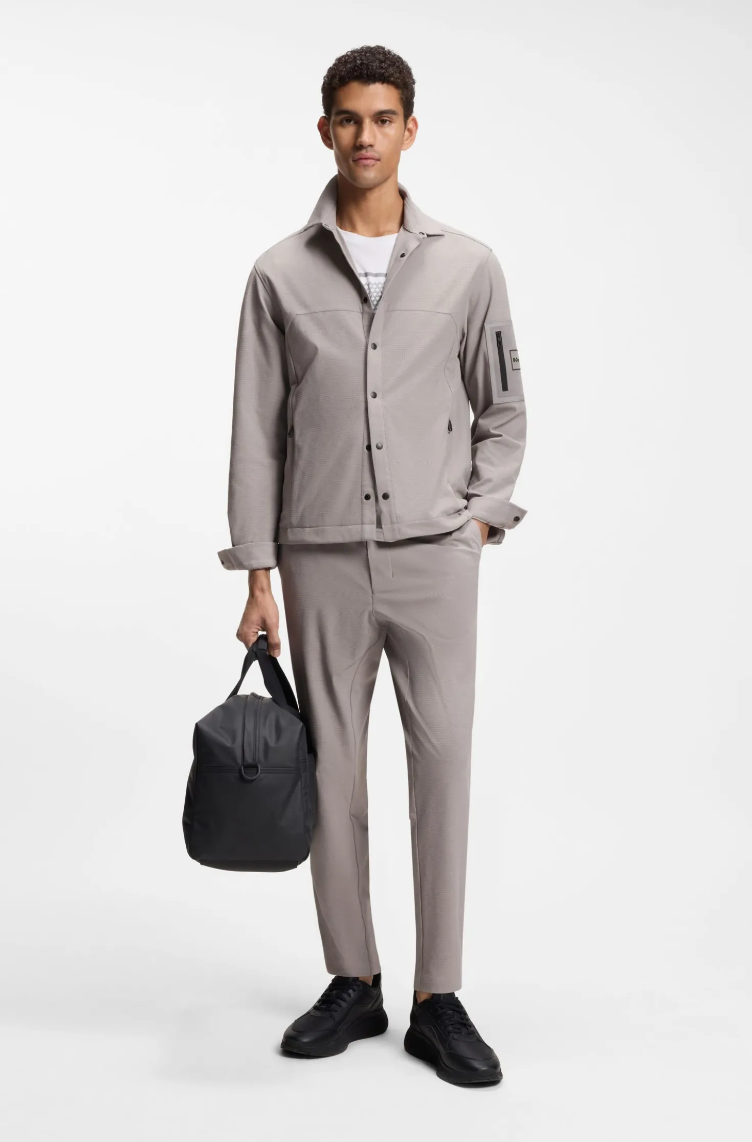Tapered-fit trousers in waffle-structured stretch fabric