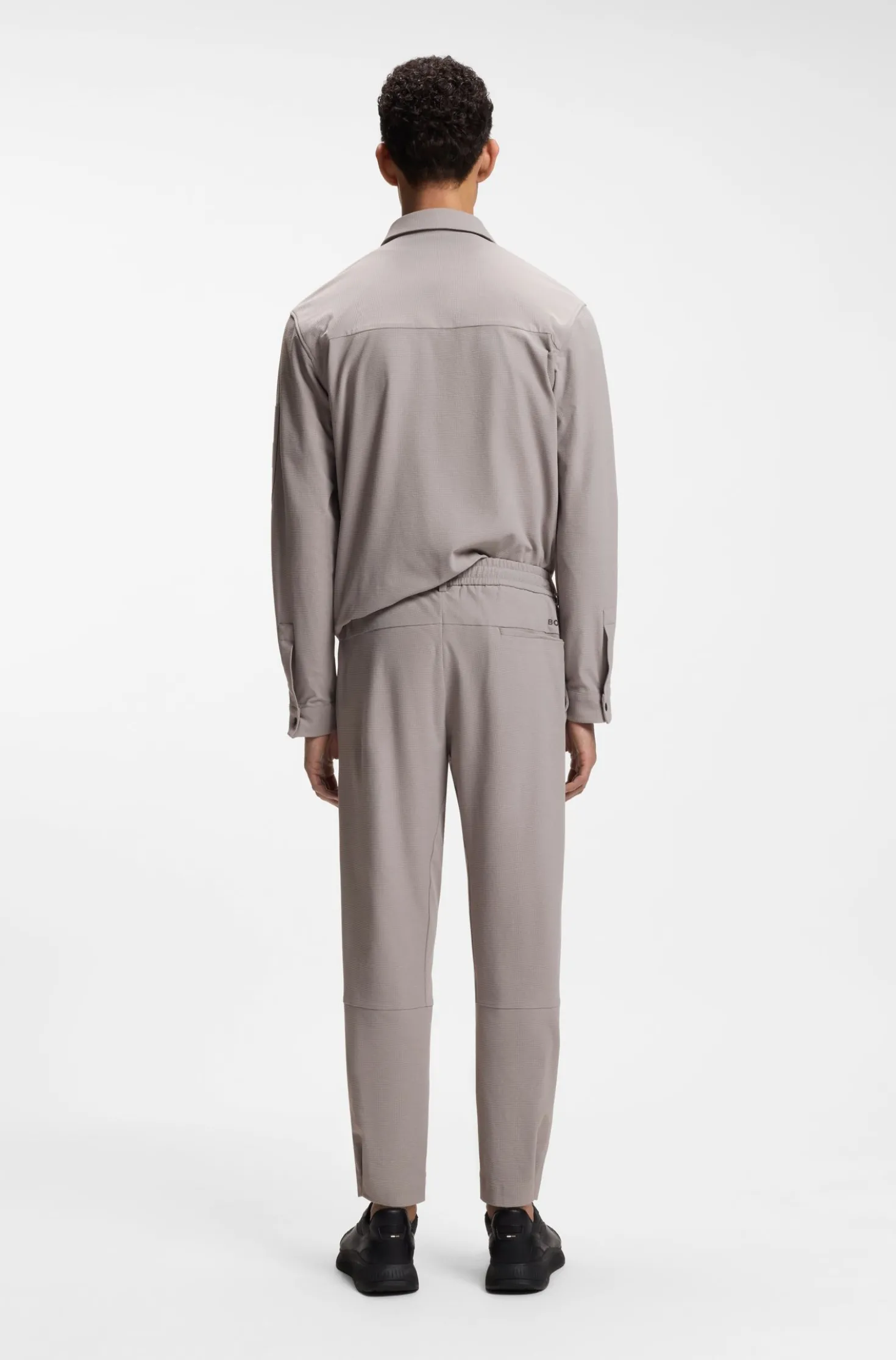 Tapered-fit trousers in waffle-structured stretch fabric