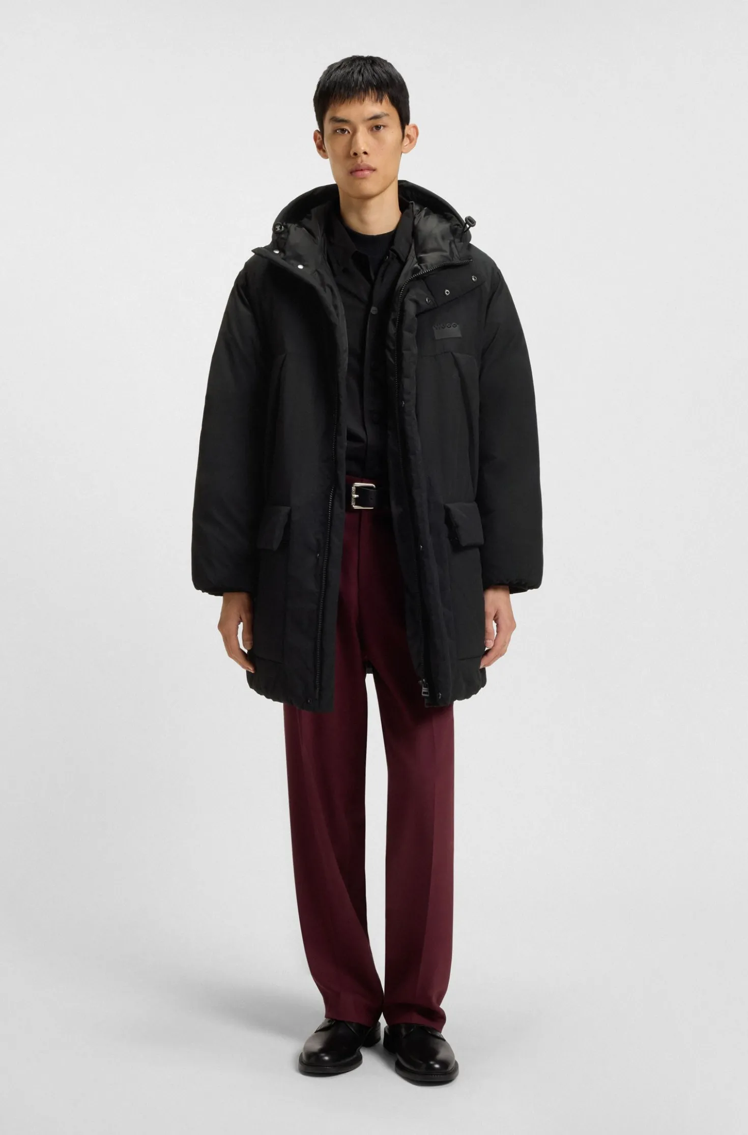 Water-repellent hooded puffer coat with split logo