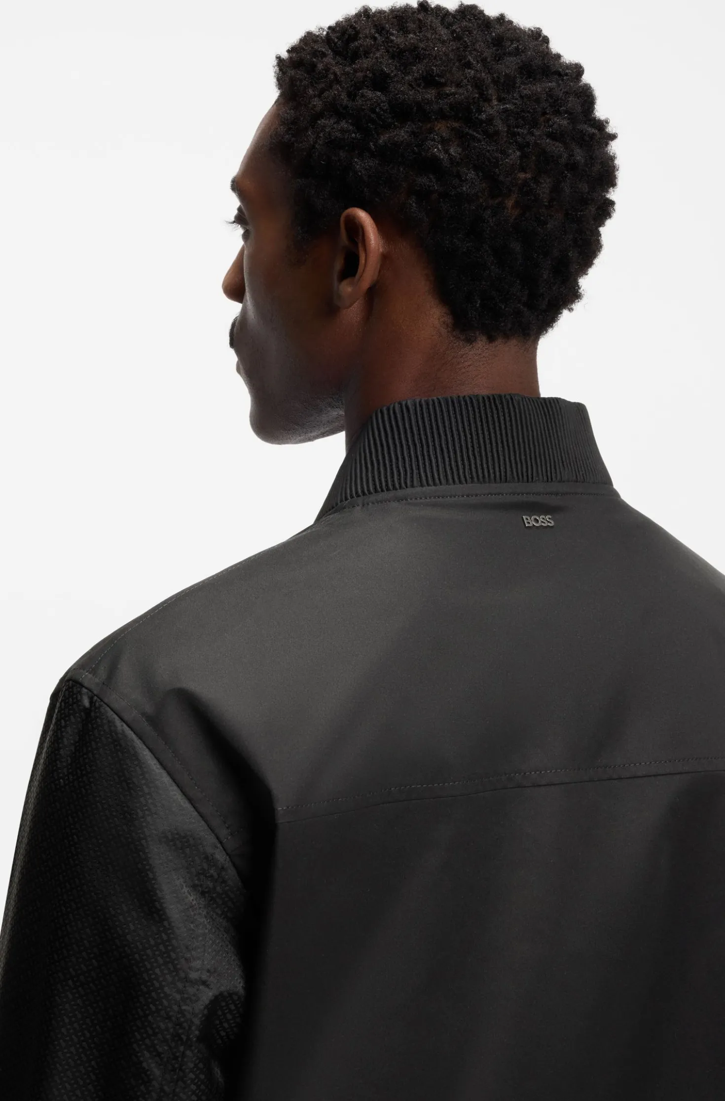 Water-repellent jacket with monogram-pattern sleeves