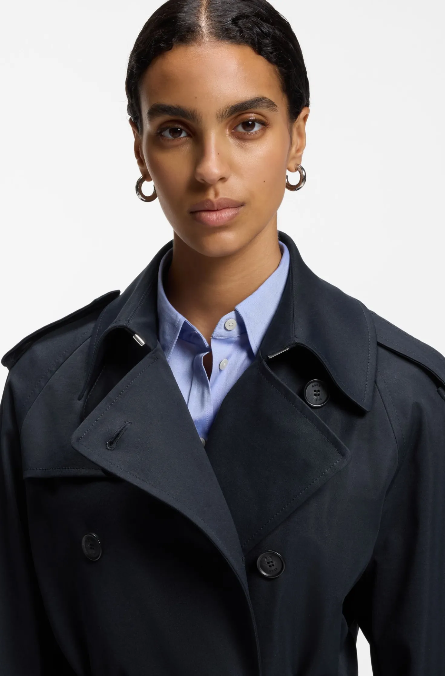 Water-repellent trench coat with buckled belt