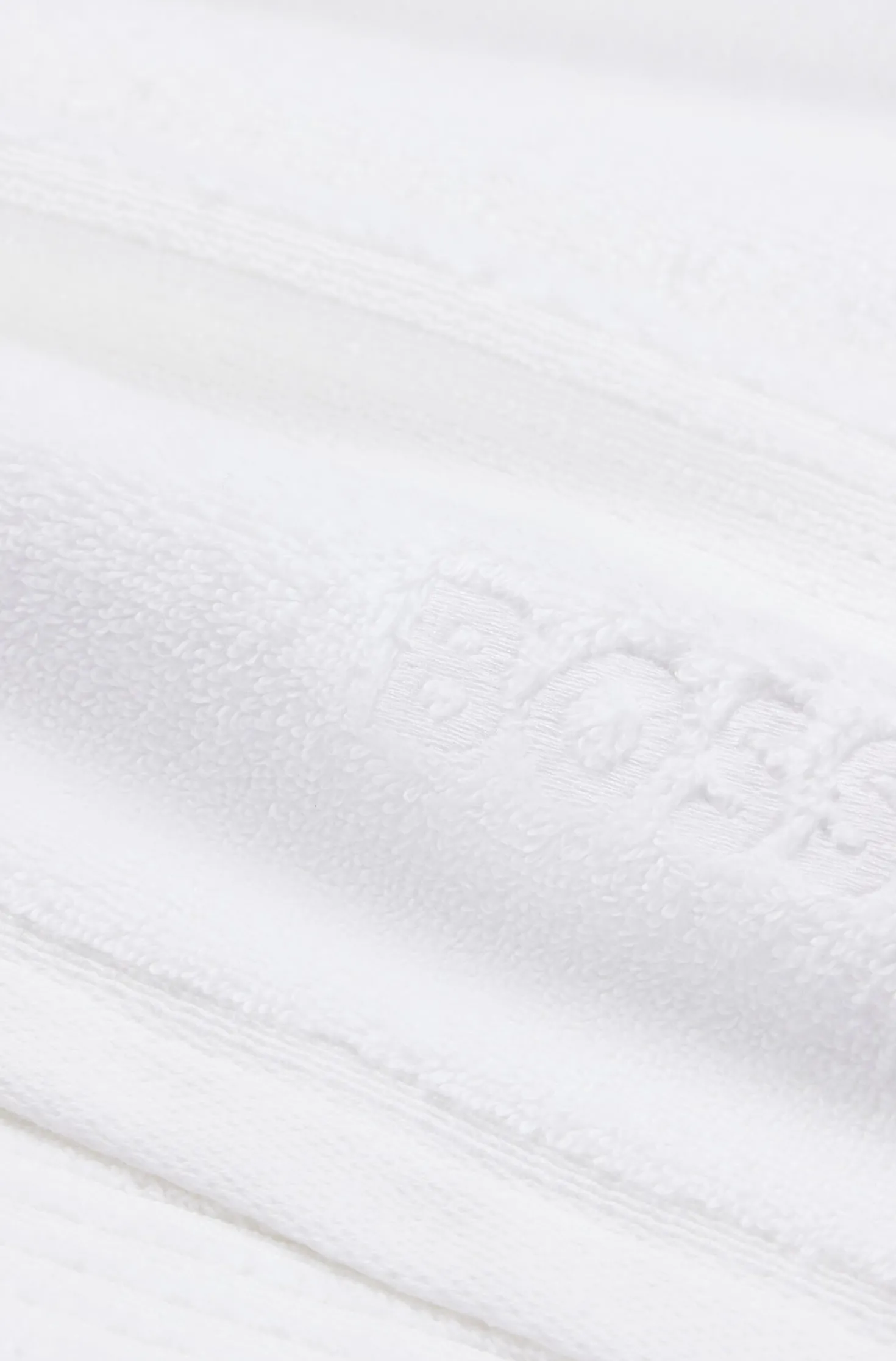 White cotton guest towel with embroidered logo