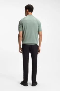 Zip-neck knit polo with body-mapping design